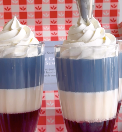 Parfait with red, white and blue layers with whipped cream.