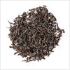 Circular pile of full leaf black tea from Sri Lanka.