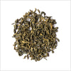 Pile of full leaf green tea on white background.