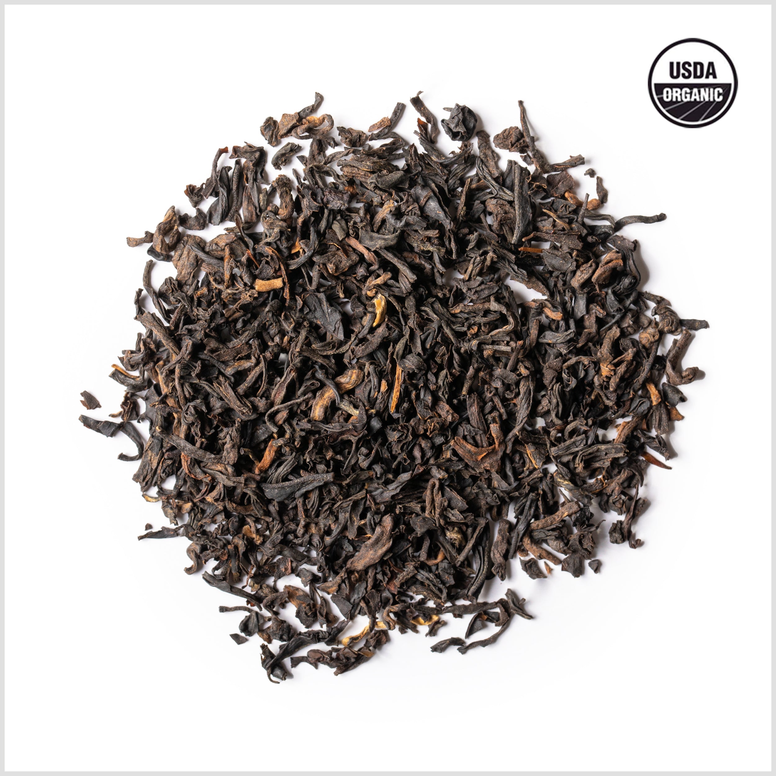 Circular pile of loose-leaf Portland Breakfast Black Tea with USDA Organic symbol.