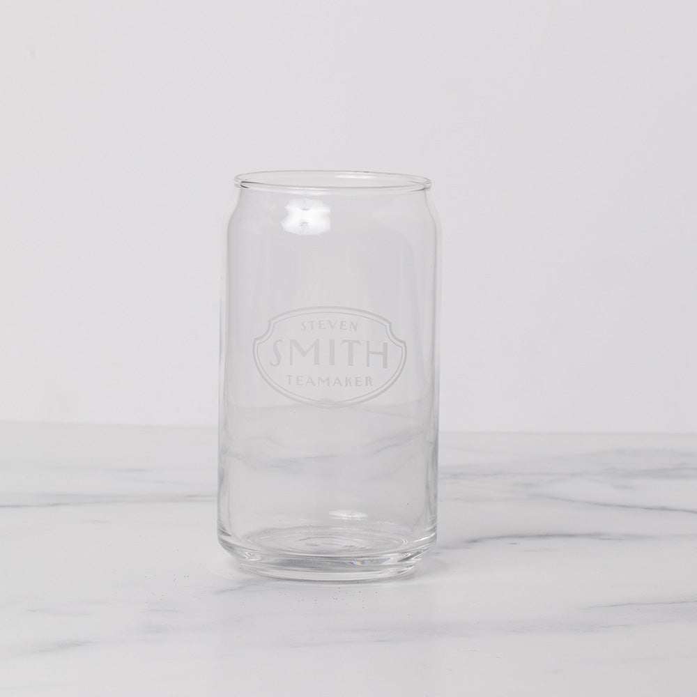 Rounded can shapped glass on a marble background.