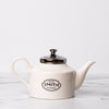 Porcelain teapot with Black smith logo and silver lid.
