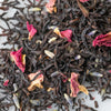 Pile of loose leaf black tea with rose petals and lavender.
