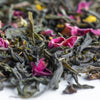 Full leaf green tea leaves with pink rose petals.