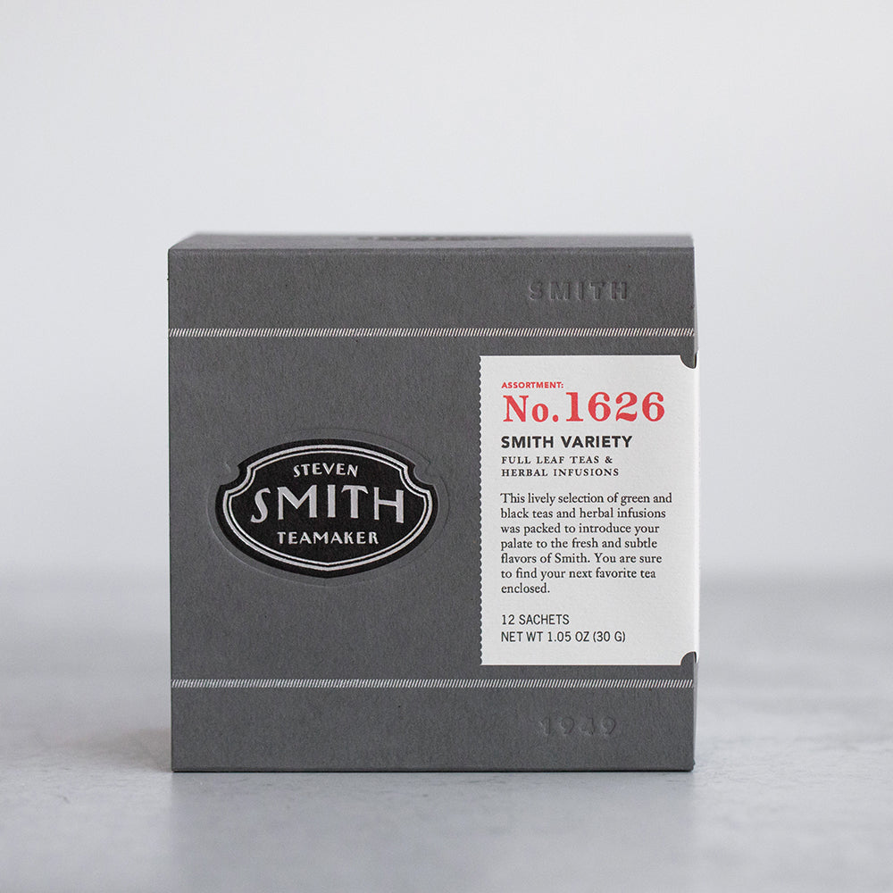 Grey box with embossed Smith logo shield and white label.