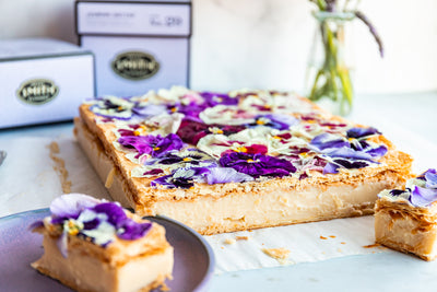 Jasmine Nectar custard bar covered in flowers, cut in half to show cross section of custard and pastry.