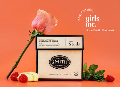 Box of Empower Mint wellness tea with raspberries, mint, ginger and rose with orange background and overlay "Benefitting Girls Inc".