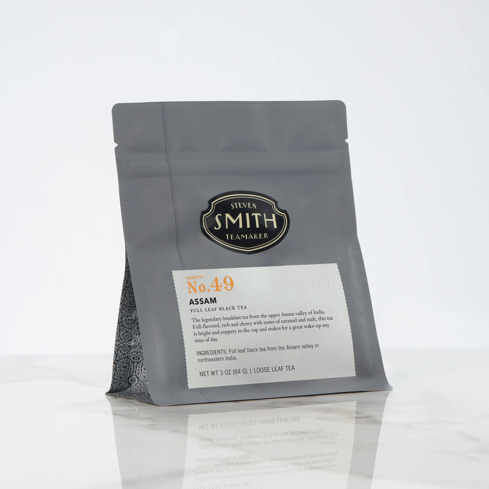 Black bag of loose leaf tea with Smith shield and Assam label