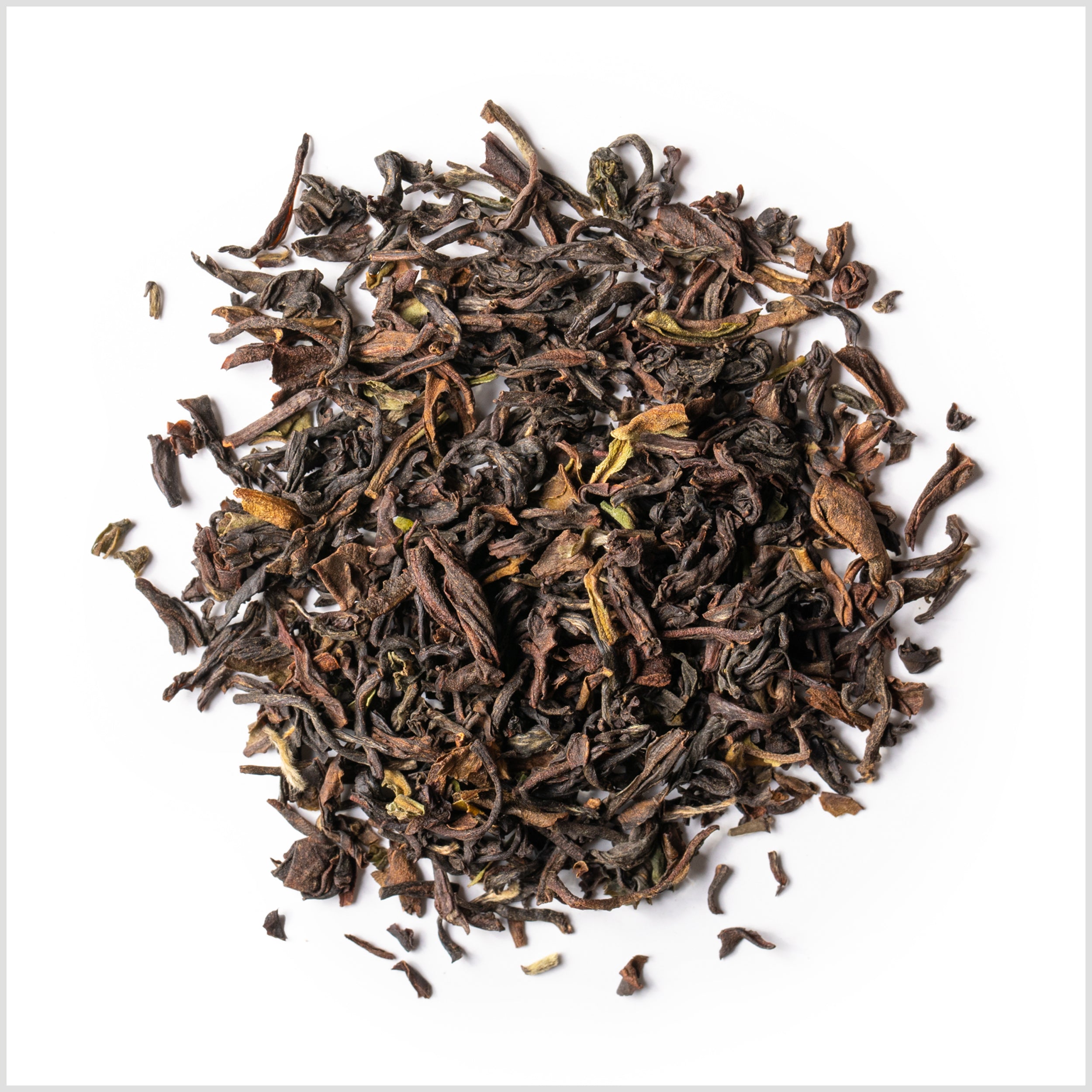 Circular pile of full leaf black tea.