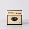 Cream box of Dandy Detox full-leaf wellness tea sachets with Smith shield in center of box.