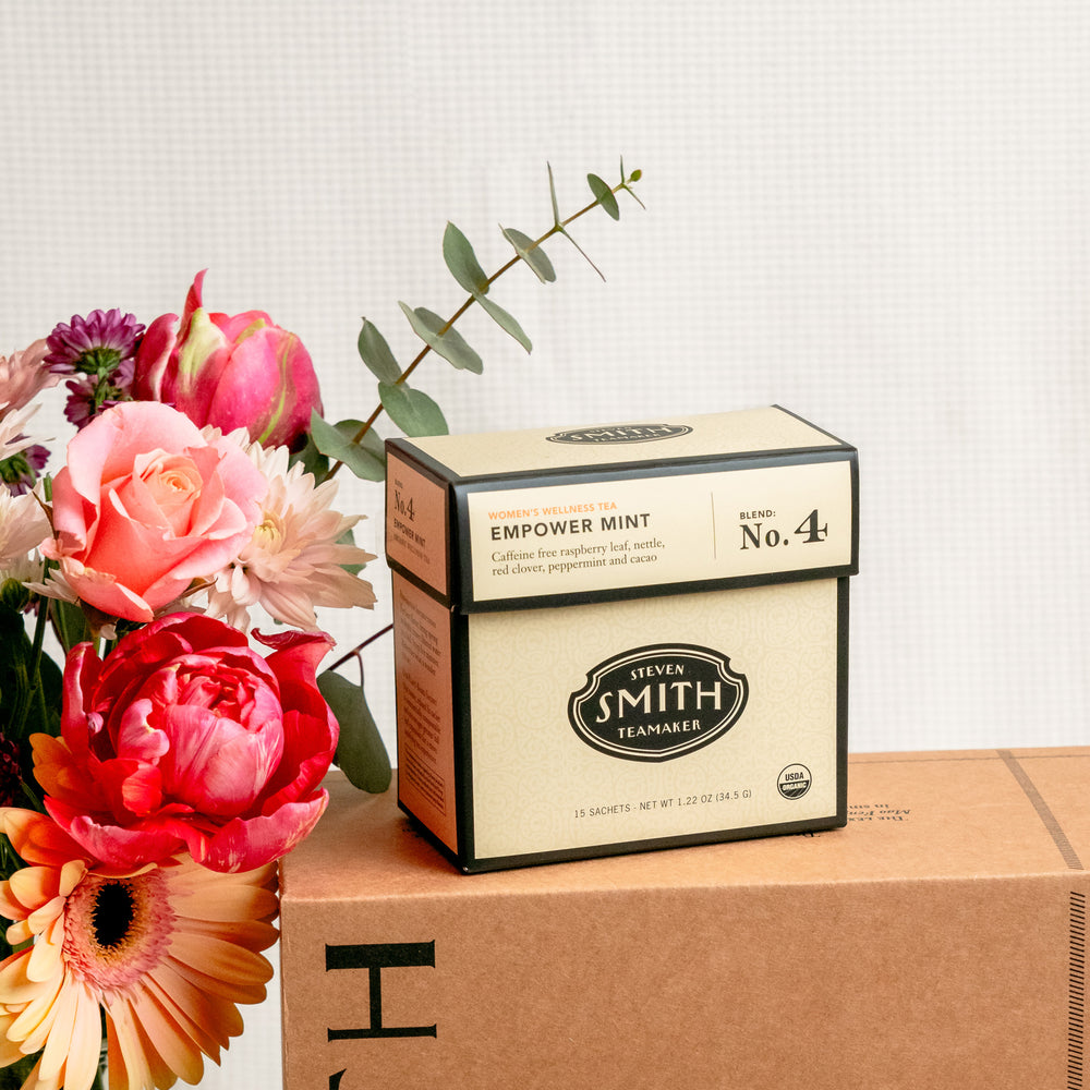 Close up on cream box of Empower Mint wellness tea.