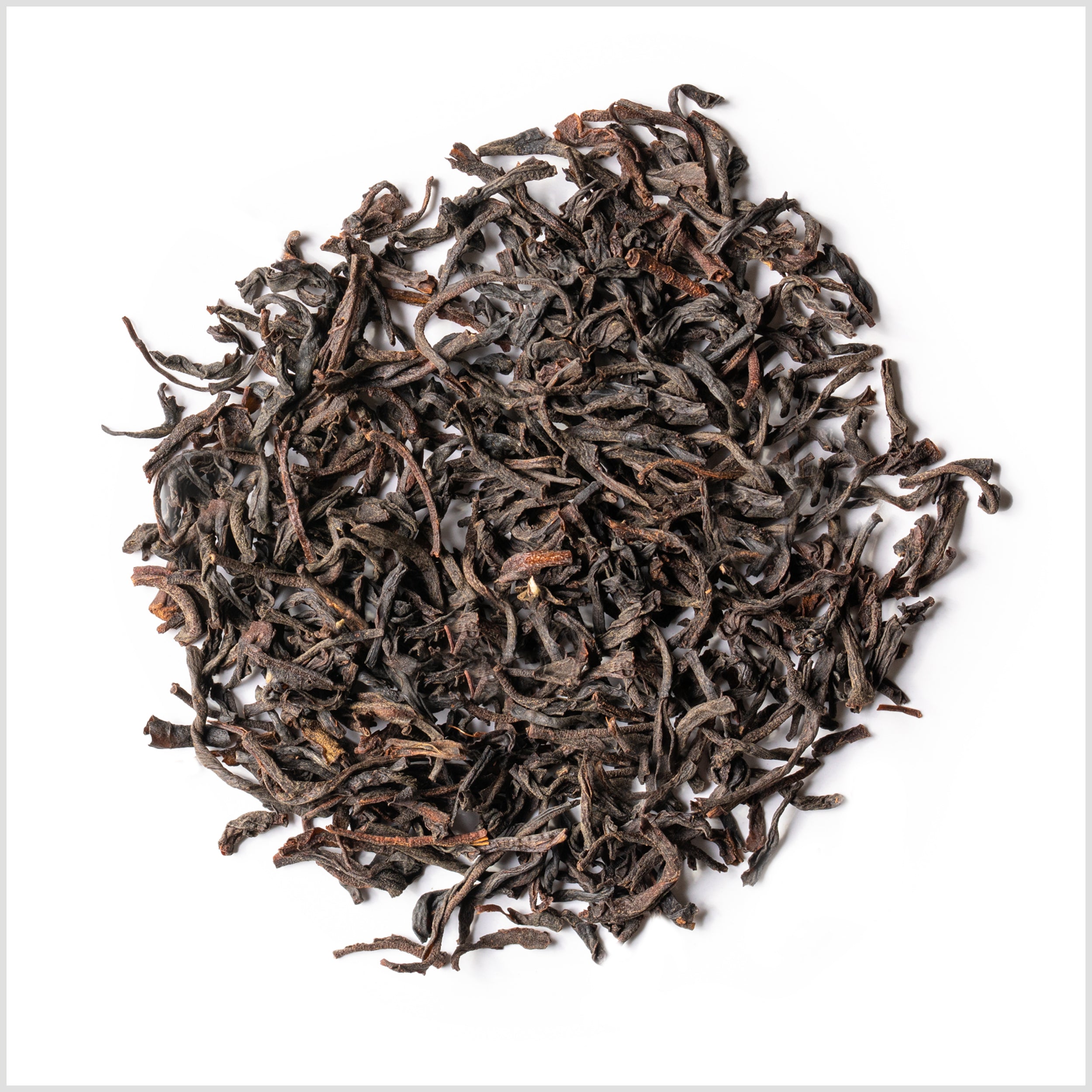 Circular pile of full leaf black tea from Sri Lanka.