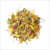 Circular pile of marigold petals, rose petals, chamomile petals, lemongrass and ginger.