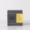 Grey box of Marigold tea with a yellow label.