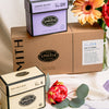 Close up shot of craft brown gift box with box of Jasmine Nectar and Empower Mint.