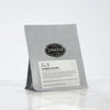 Gray bag of loose leaf tea with Smith shield and Phoenix Oolong label