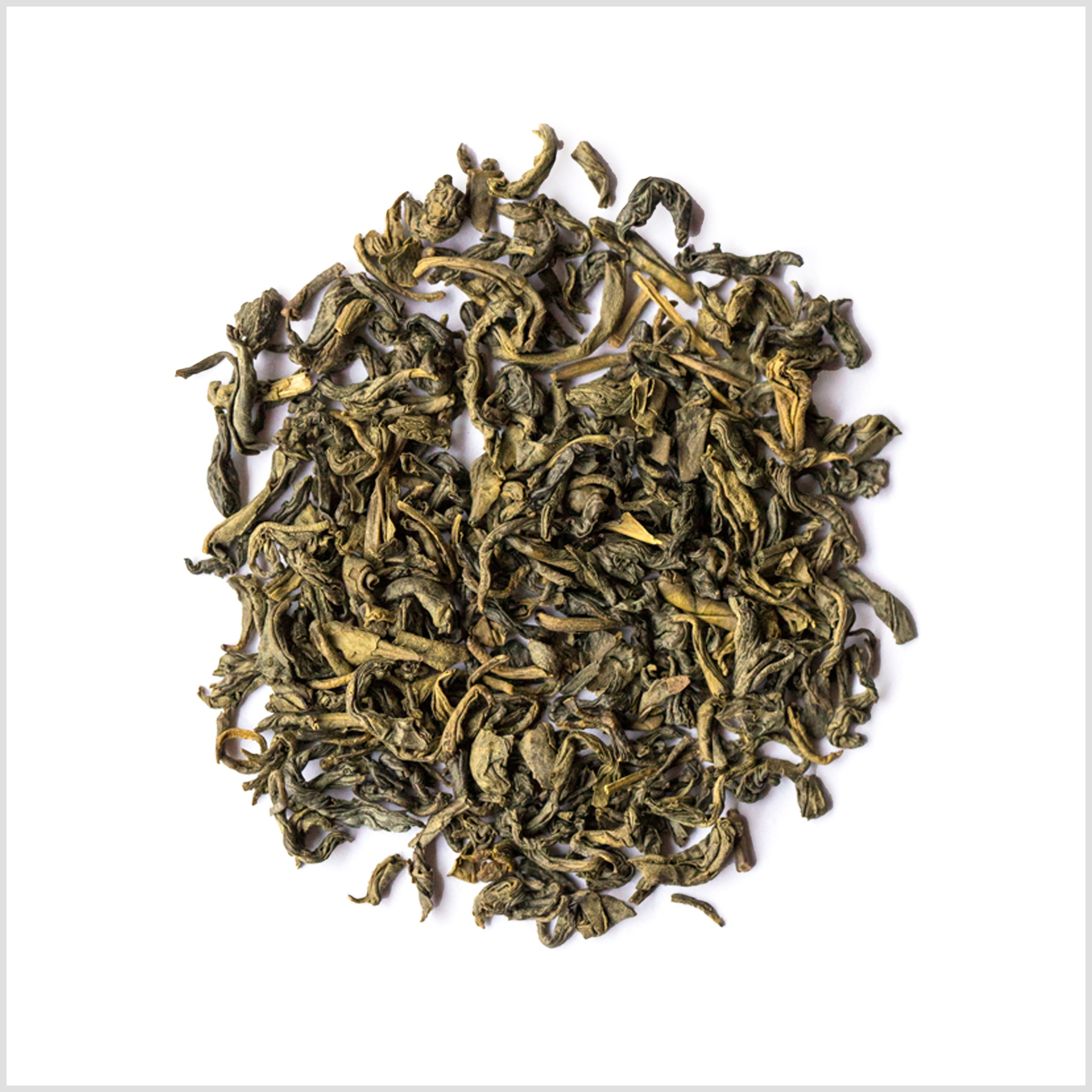 Pile of full leaf green tea on white background.