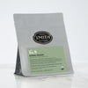 Grey bag with green Spring Greens label and Smith logo.
