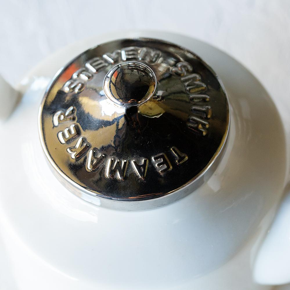 Stainless steel lid to teapot that says Steven Smith Teamaker.